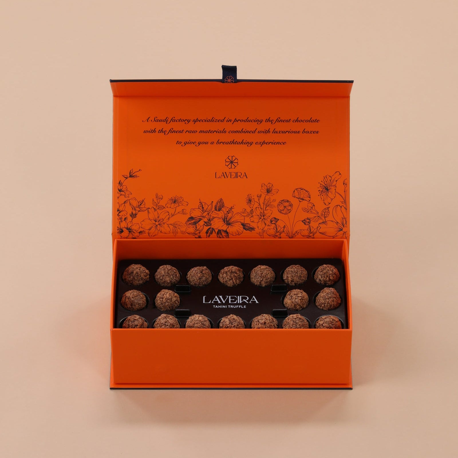 Orange box of Lavera chocolate truffles on a beige background
