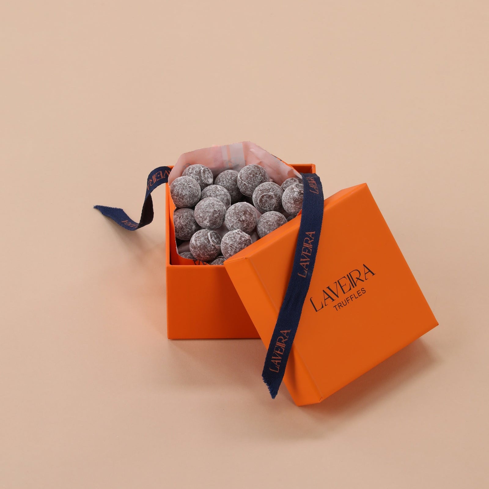 Orange box with gray truffles 